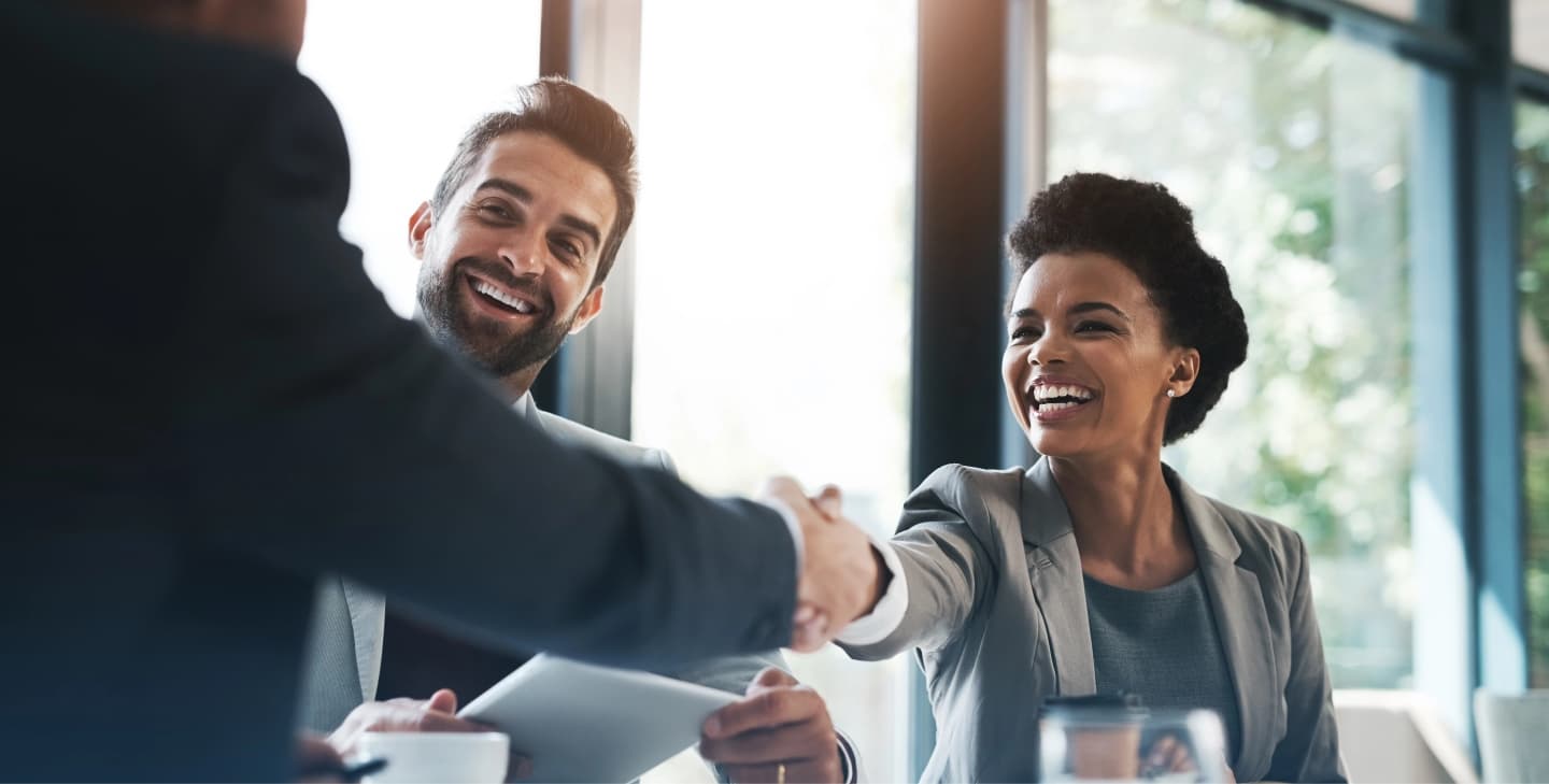 Professionals networking at a Mississauga Board of Trade breakfast setting