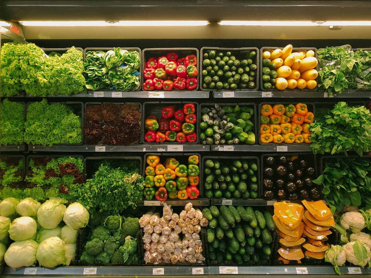 Assorted fresh vegetables displayed at a market stall