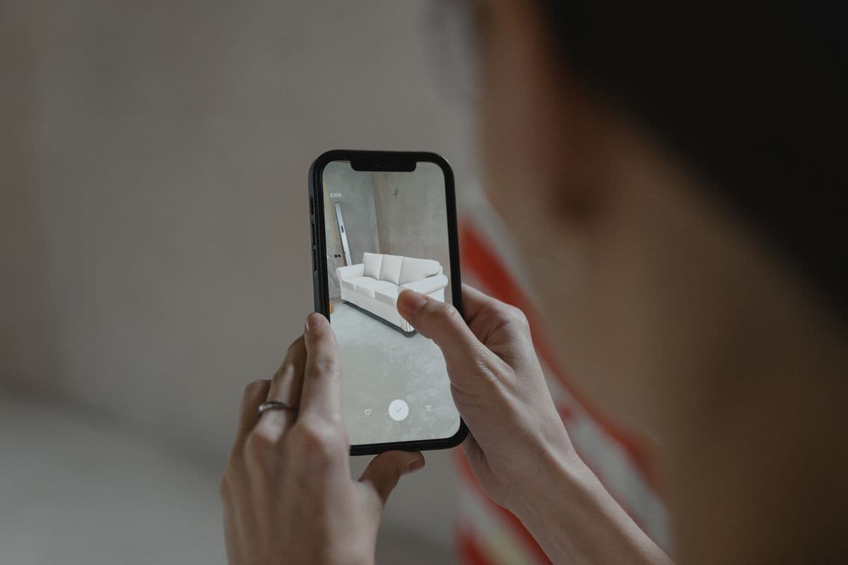 Person reviewing documents at a desk with a phone nearby