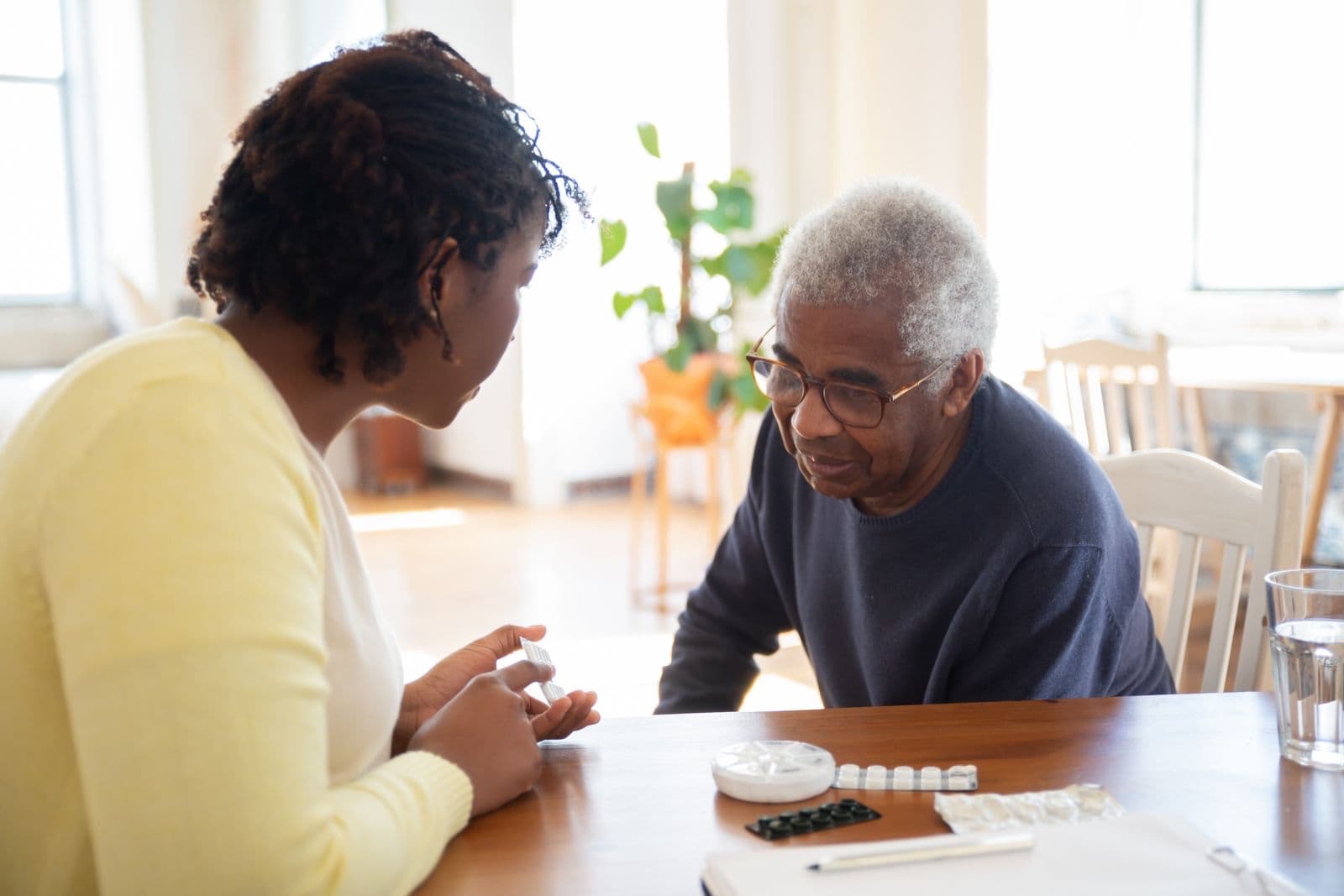 Family caregiver helping an older relative at home