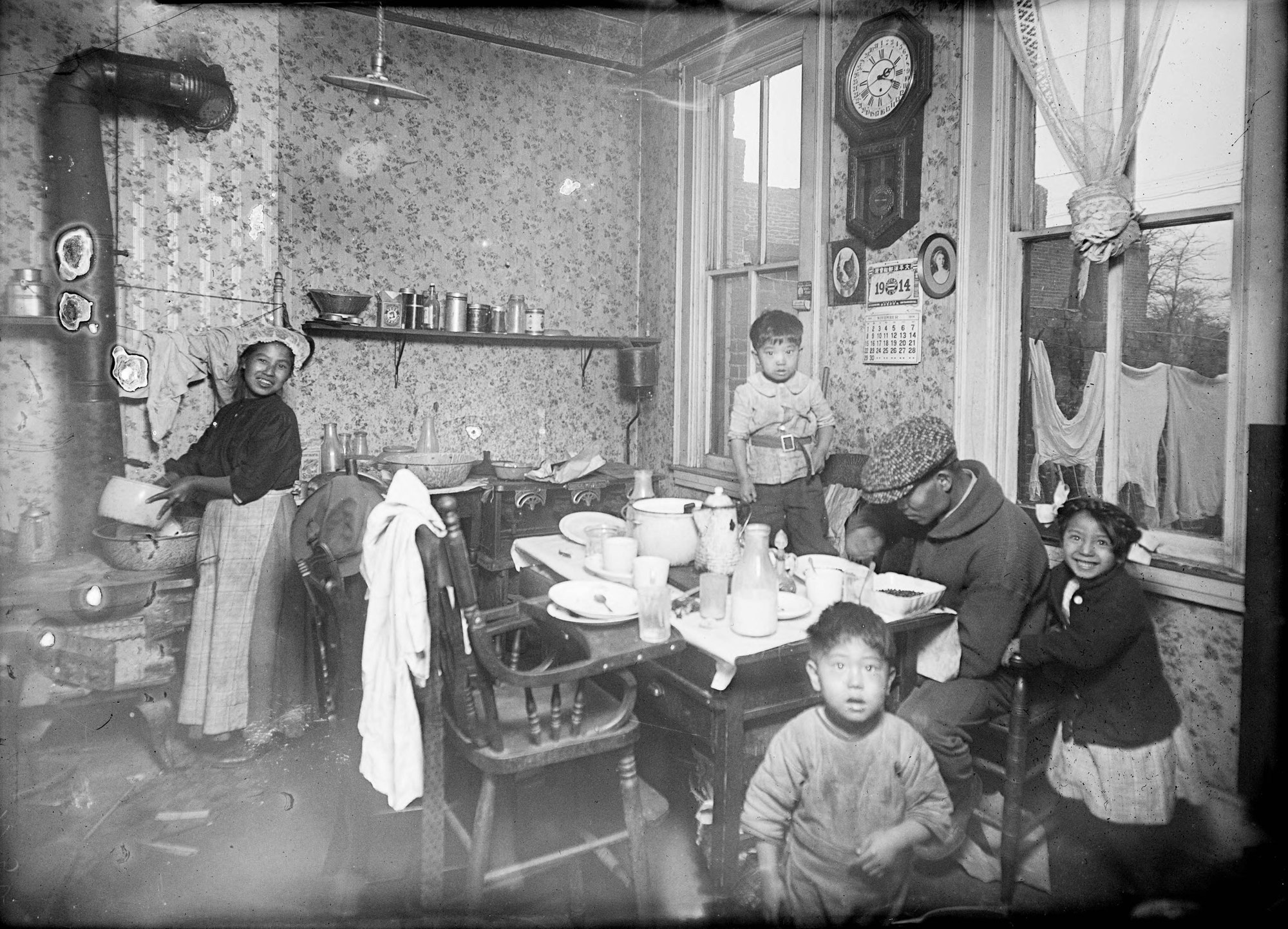 Chinese American family seated around a dinner table in a Denver home