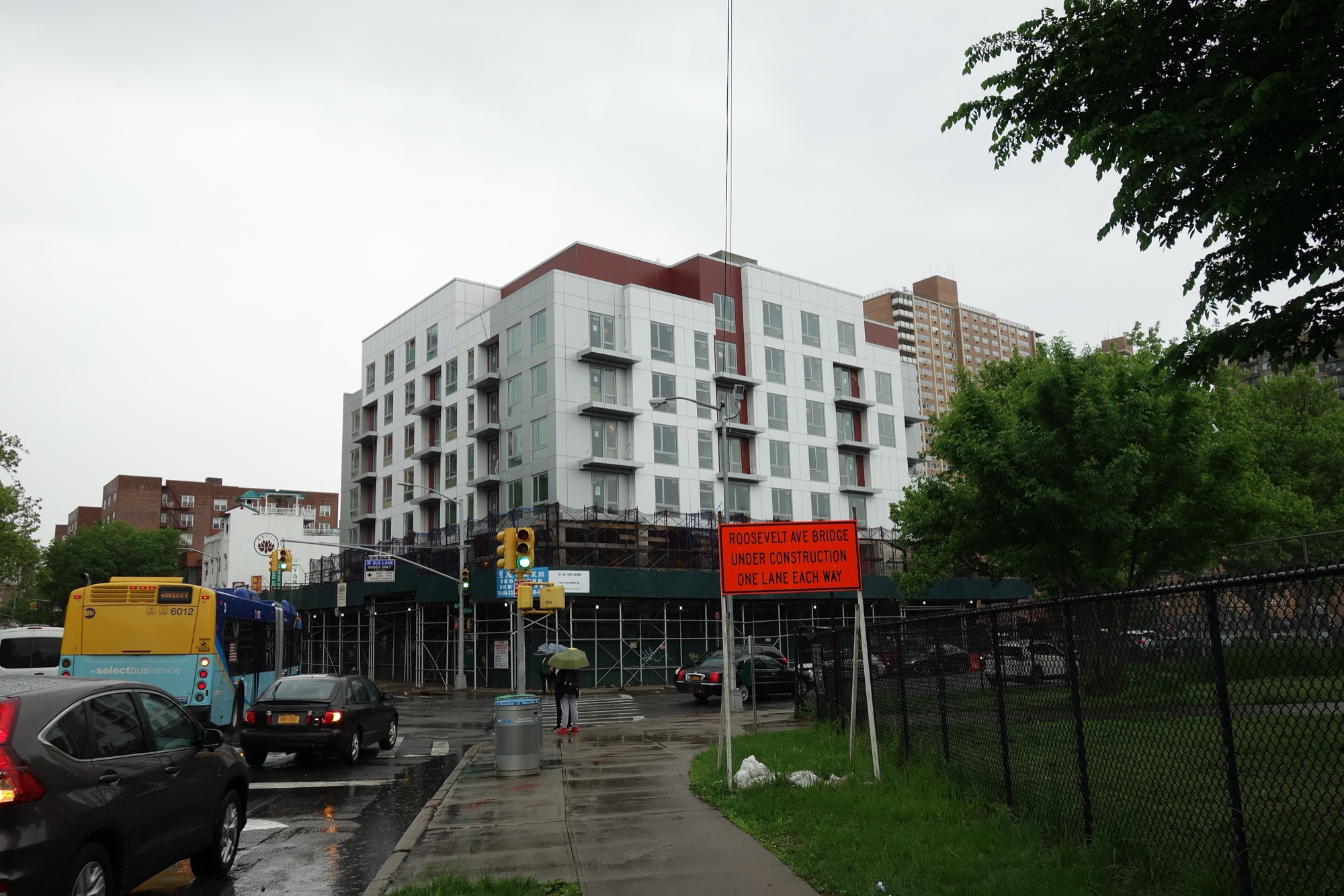 New apartment construction beside street work in Flushing, Queens
